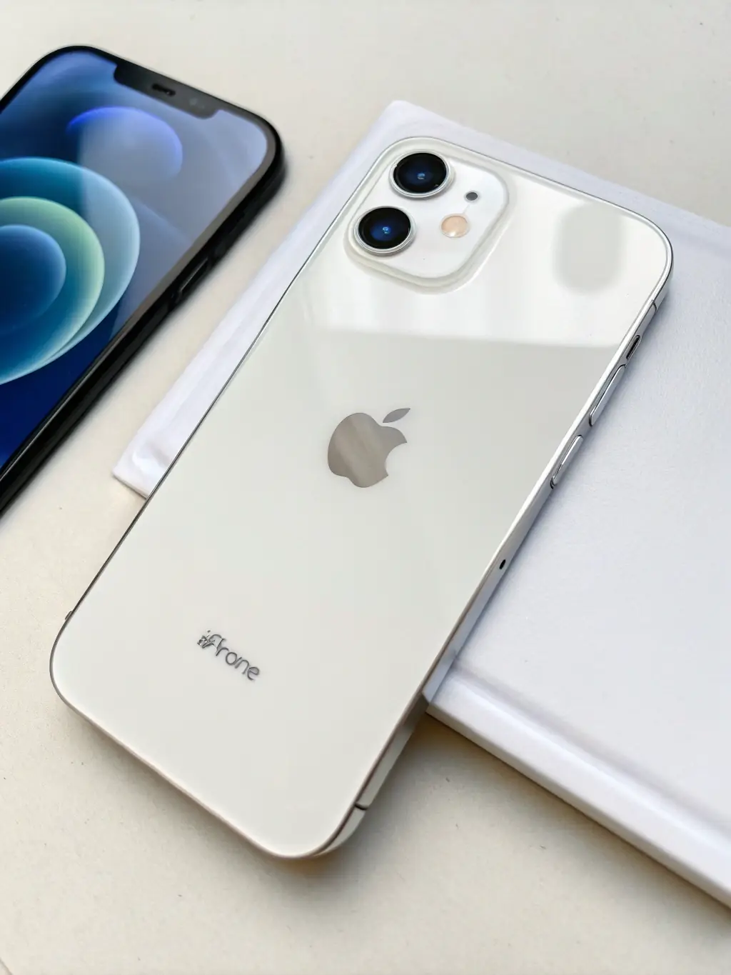 A high-quality studio shot of a refurbished iPhone 12 Pro in excellent condition, showcasing its sleek design and pristine screen. The background is a clean, neutral color to emphasize the phone's features.